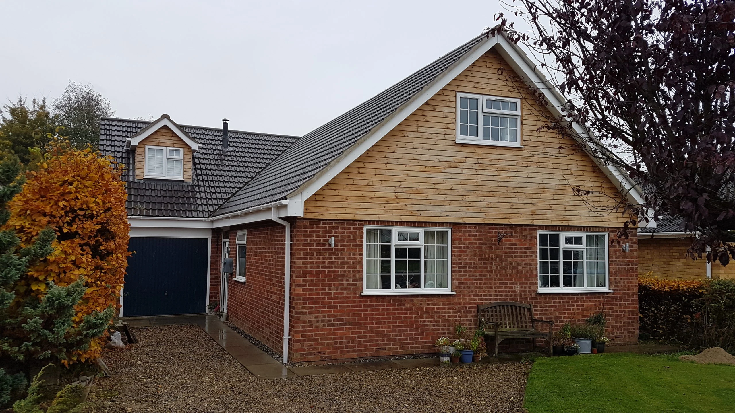 driveway view of bungalow with roof lift