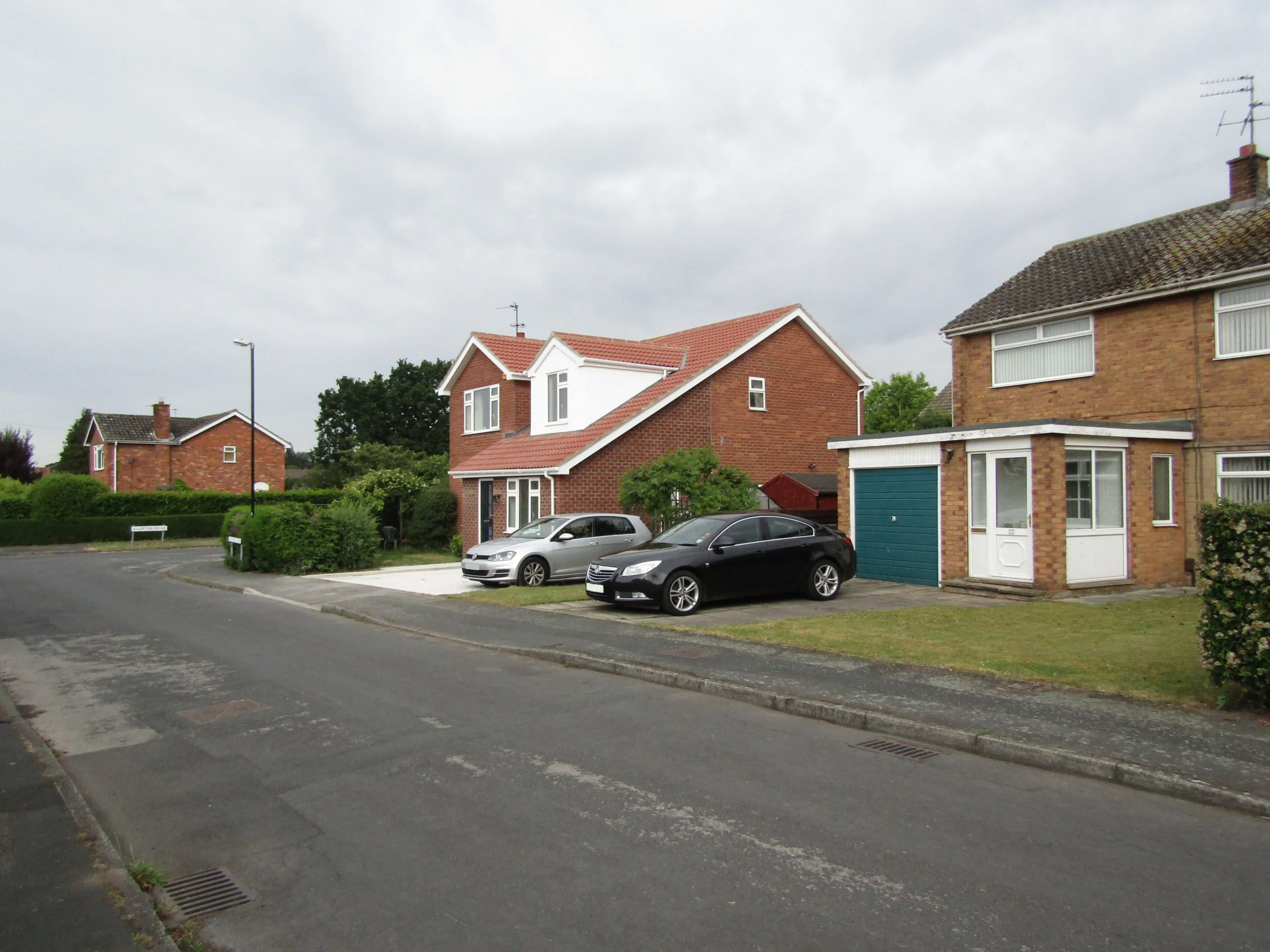 Distant street view of single storey extension and loft conversion