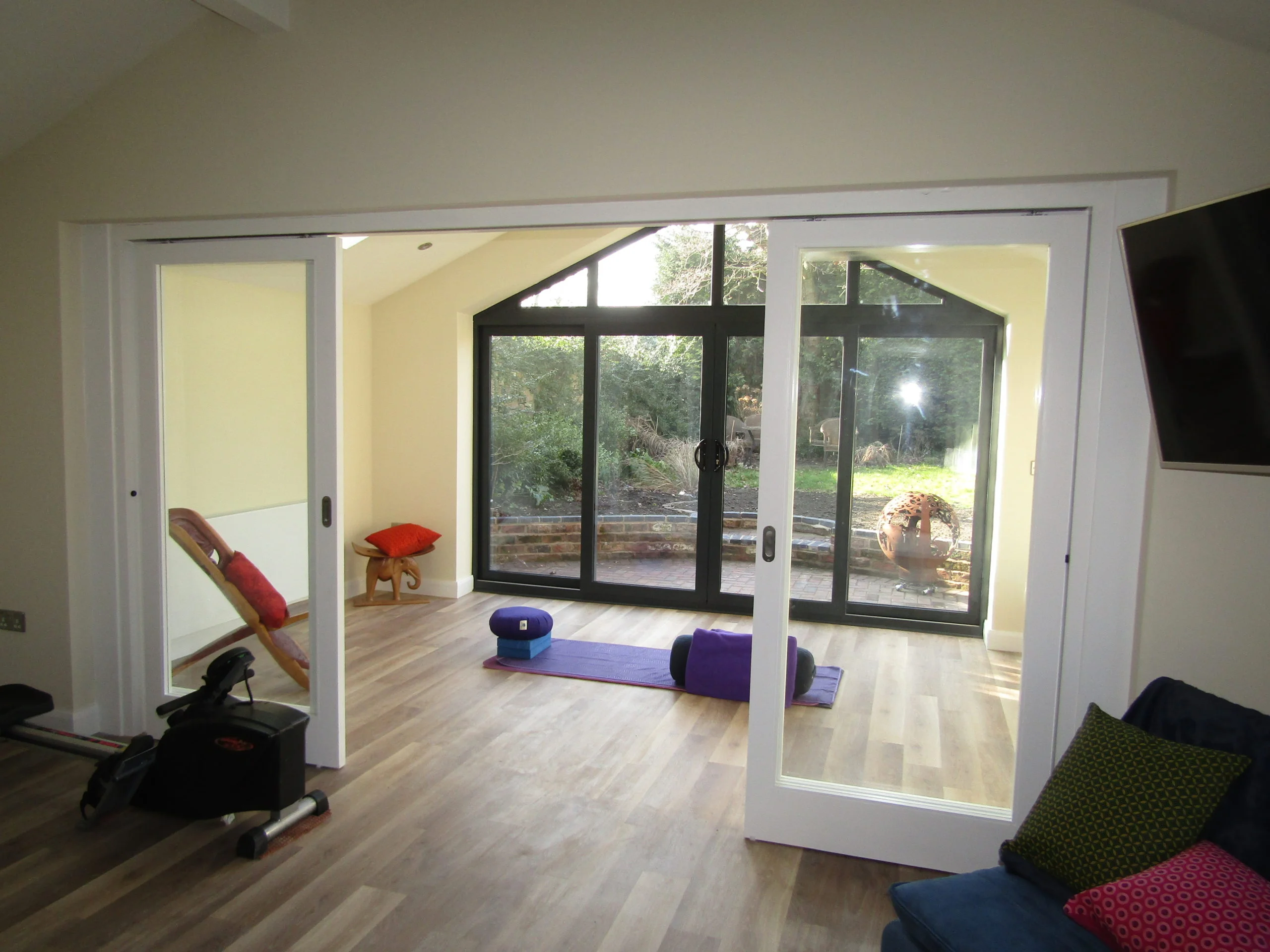 wide double doors inside open garage conversion