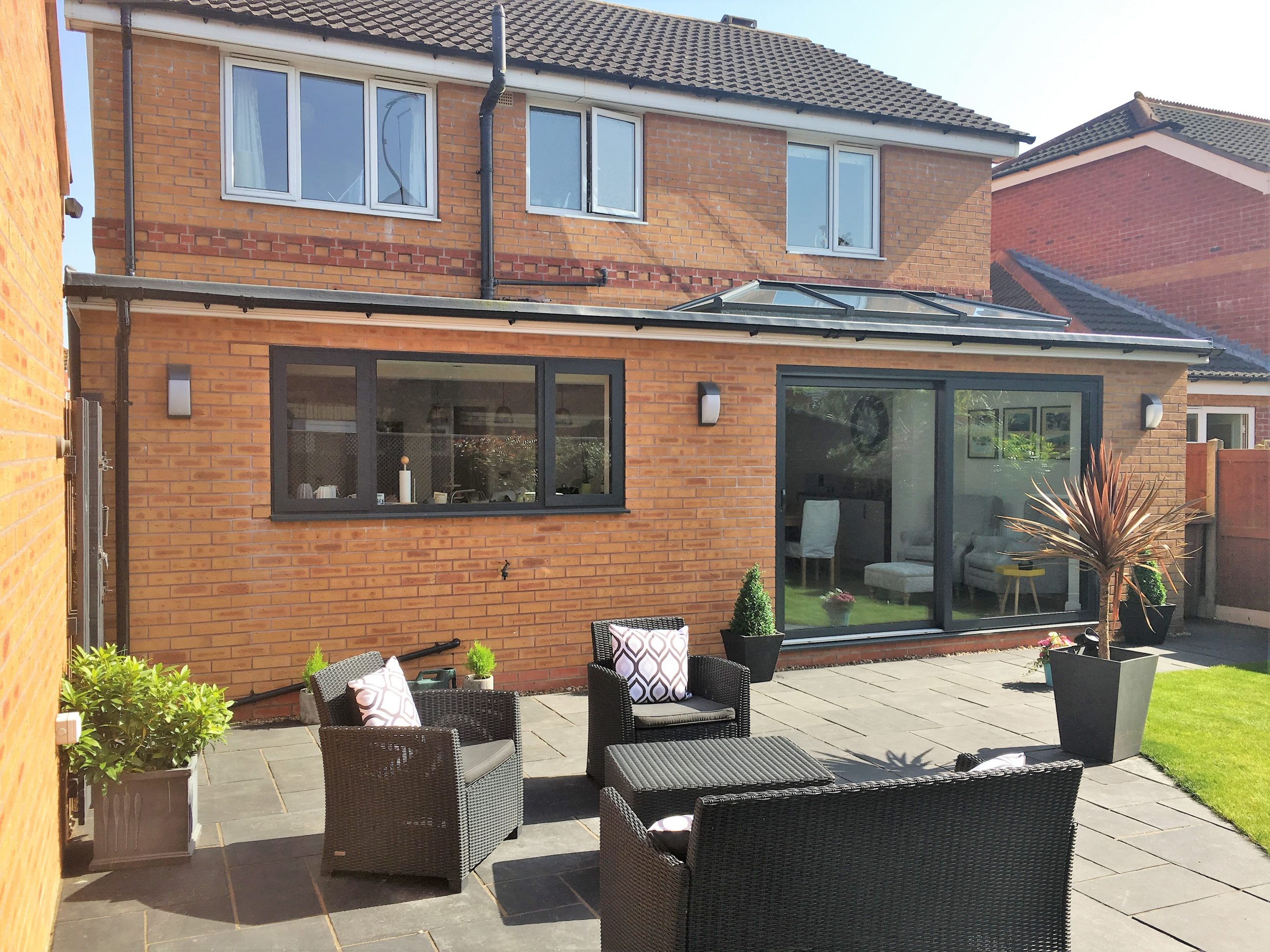 View of single storey extension and lawn furniture