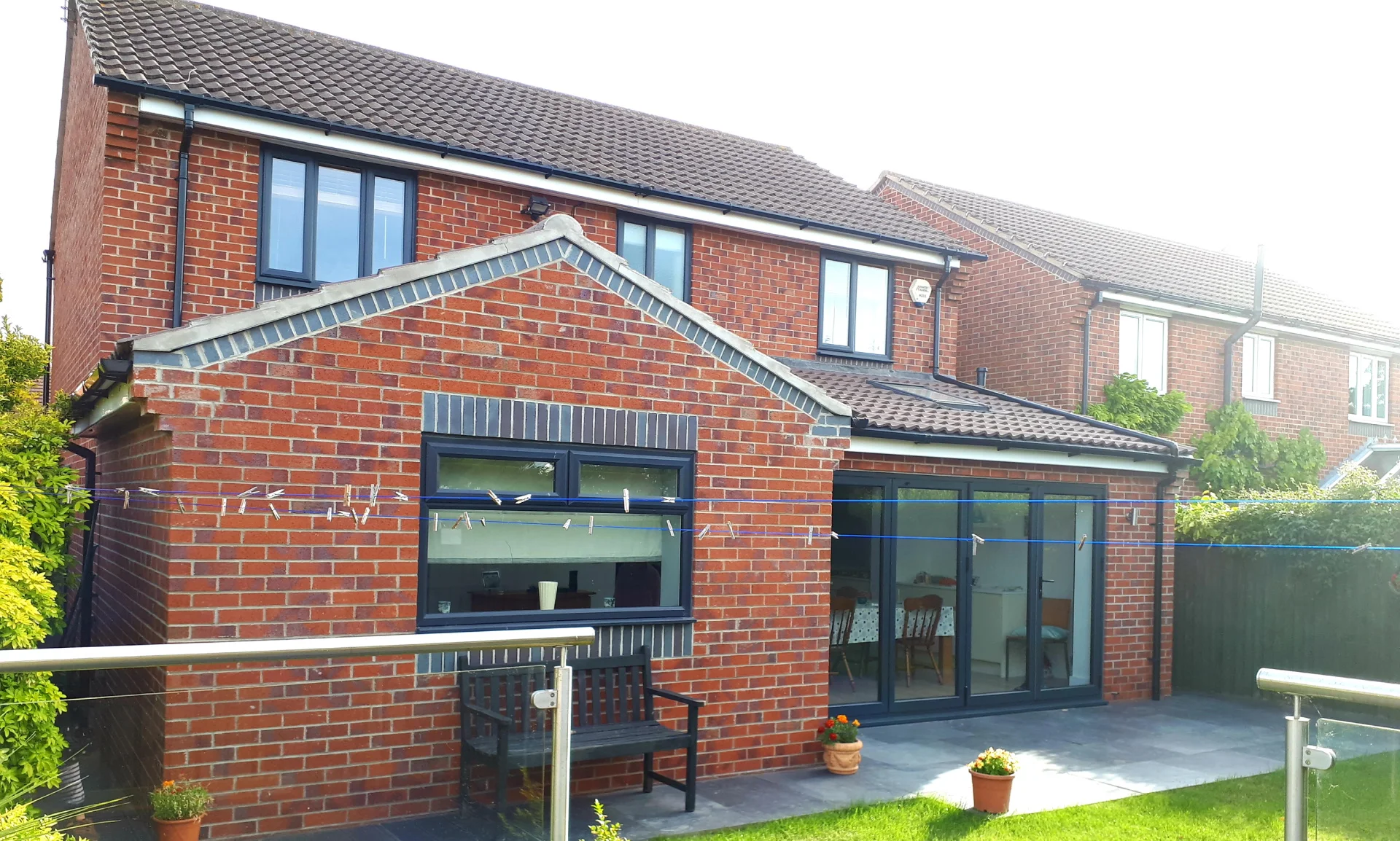 Garden view of single storey extension with bifold doors