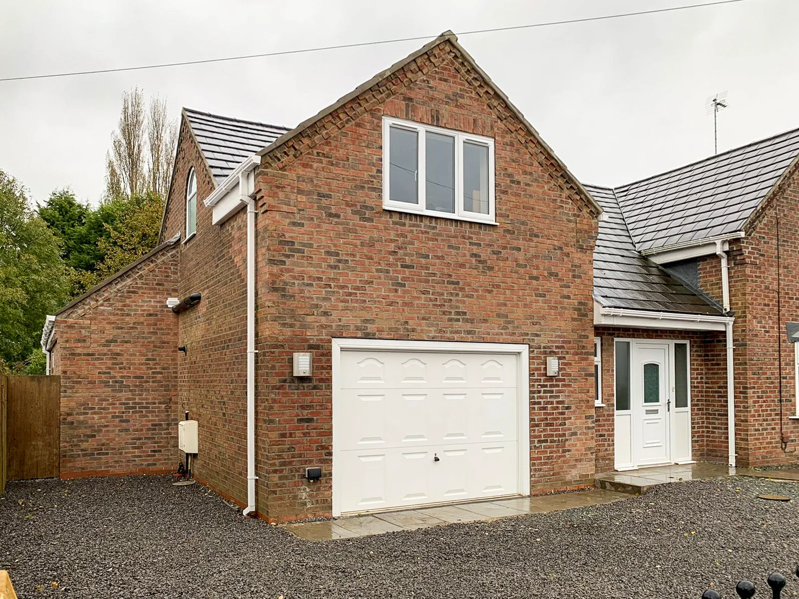 Garage and side view of double storey extension