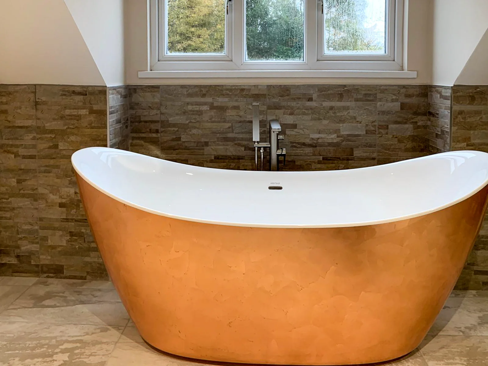 bronze bathtub inside new bathroom