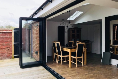 Single storey house extension with bifold doors open in Bradford