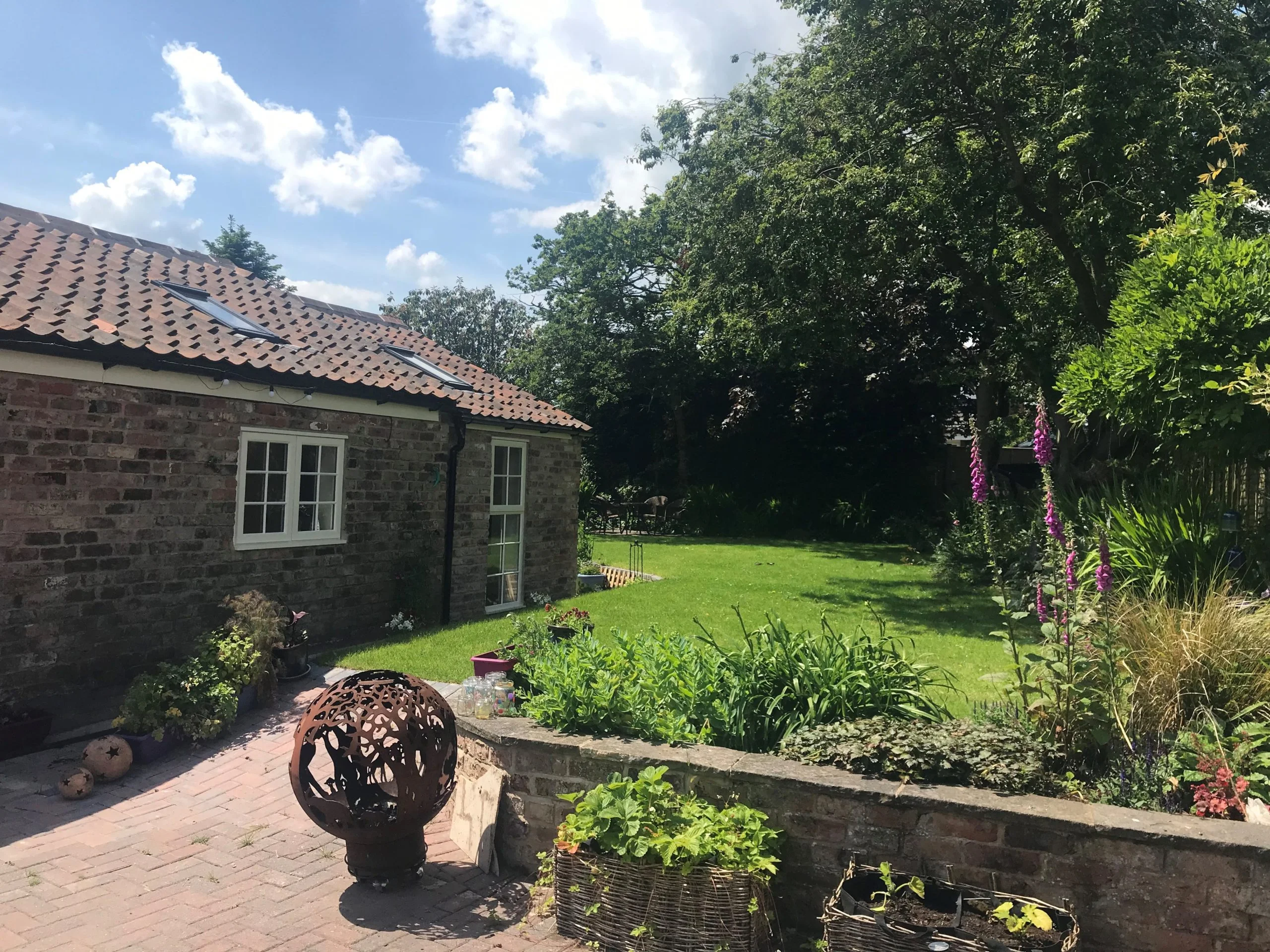 scenic garden landscape with garage conversion